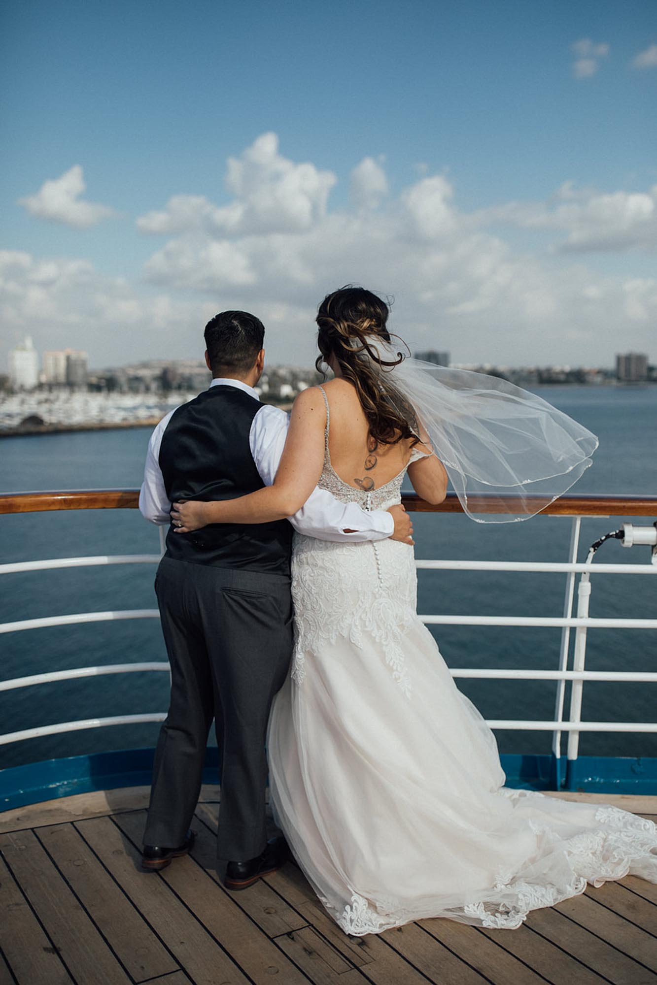 Cruise wedding with attendants in dusty rose gowns and brown suits | Toni G Photo | Featured on Equally Wed, the leading LGBTQ+ wedding magazine