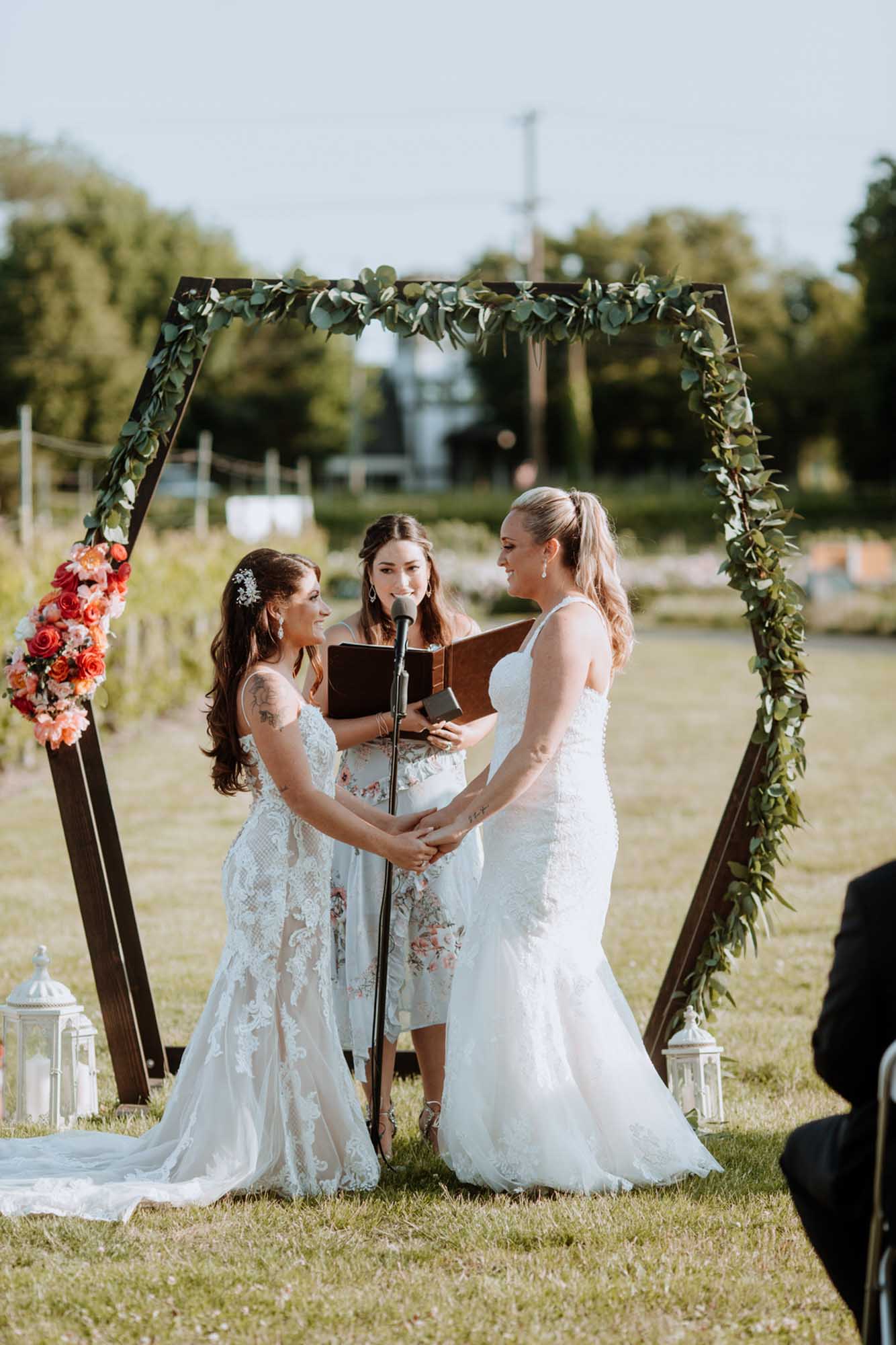 New Jersey winery wedding with gorgeous geometric arch | Saltwater Studios | Featured on Equally Wed, the leading LGBTQ+ wedding magazine