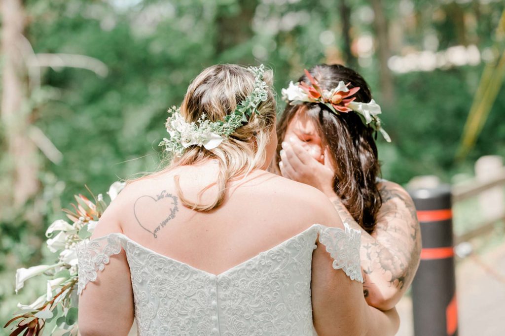 Backyard New Hampshire wedding with white and pastel florals and a dog of honor | Ali B Photography | Featured on Equally Wed, the leading LGBTQ+ wedding magazine