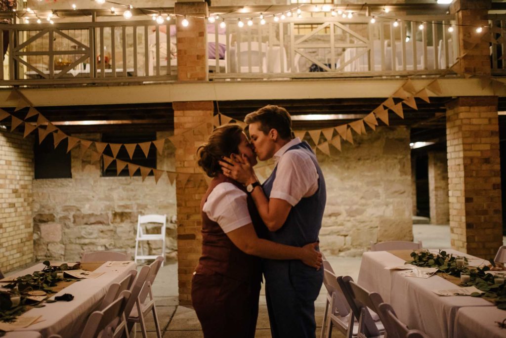Small autumn wedding with picnic food, folk music, and burlap accents | Friends & Lovers Photography | Featured on Equally Wed, the leading LGBTQ+ wedding magazine