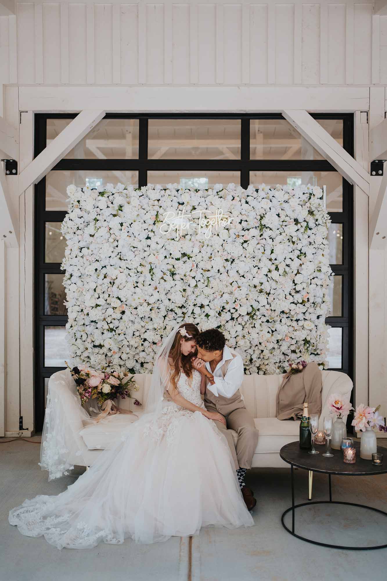 Chic barn wedding ideas with flower all and circular arch | Forest and Fog Collective | Featured on Equally Wed, the leading LGBTQ+ wedding magazine