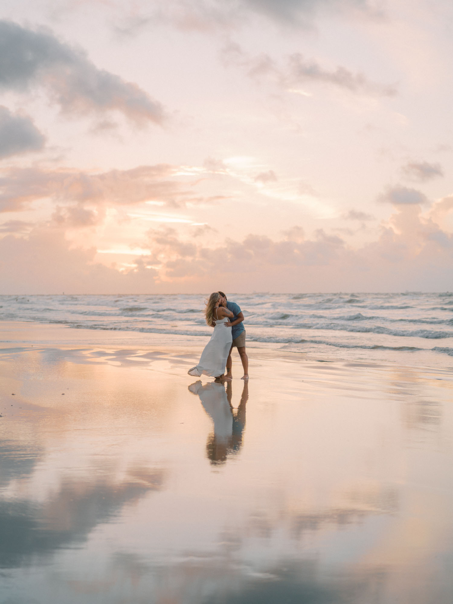 Glowing sunrise engagement session on the beach after Disney World proposal | Caitlin Rose Photography | Featured on Equally Wed, the leading LGBTQ+ wedding magazine