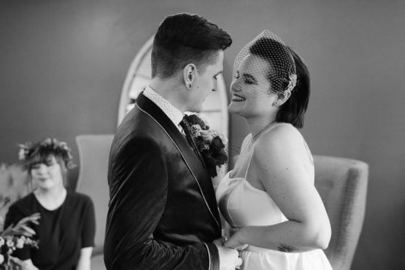 Black-and-white photo of queer wedding couple