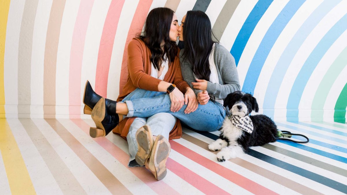 “Just because” plant shop photo session with rainbow wall celebrates love and a new puppy