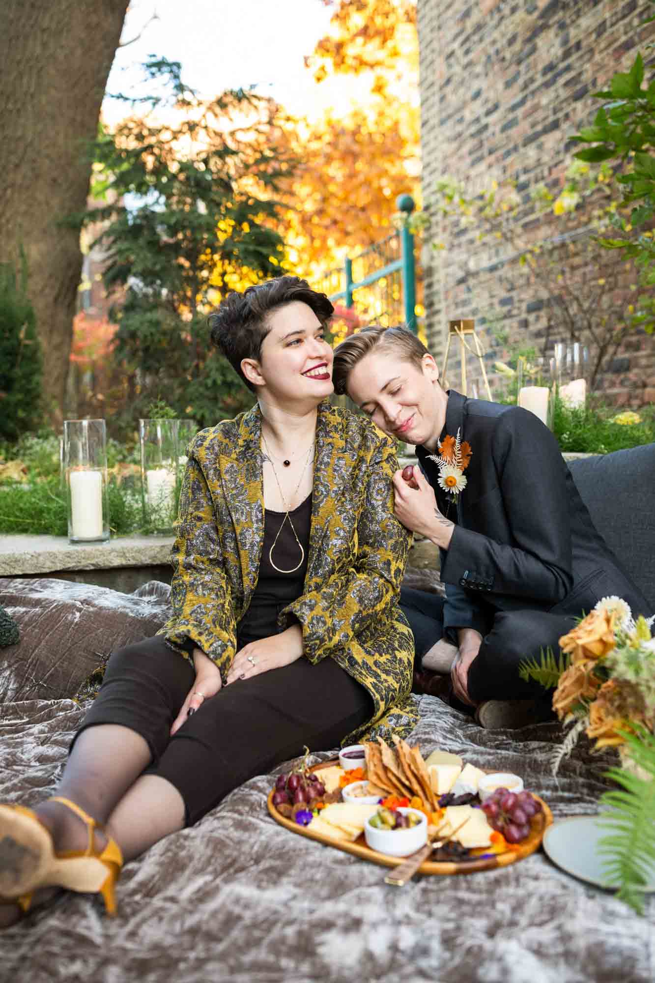 Moody fall picnic proposal ideas with cheeseboard and bottled cocktails | AJ Abelman | Featured on Equally Wed, the leading LGBTQ+ wedding magazine