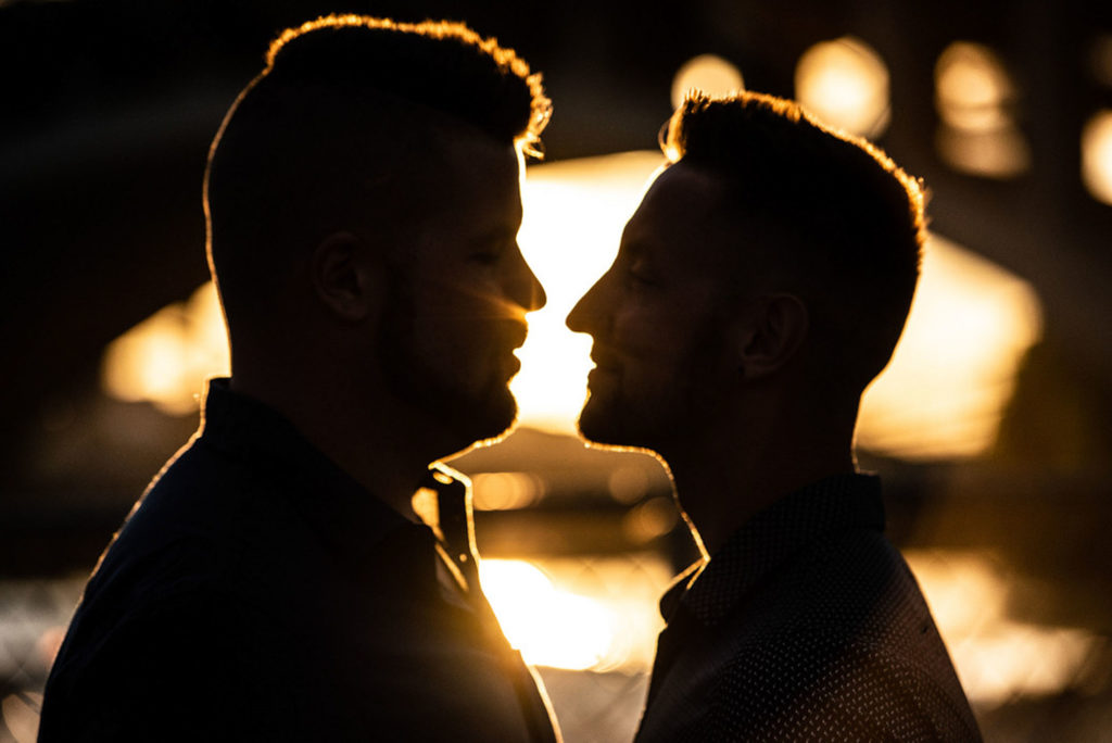 Sunset Minneapolis engagement session with adorable Corgi cameo | RKH Images | Featured on Equally Wed, the leading LGBTQ+ wedding magazine