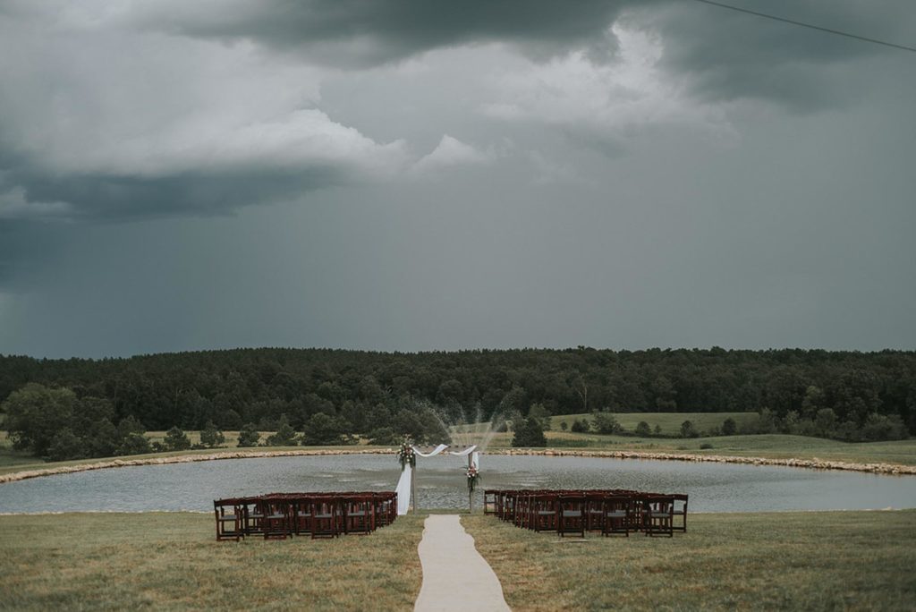 Waterside Georgia farm wedding with pink floral cake | Starglass Photography | Featured on Equally Wed, the leading LGBTQ+ wedding magazine