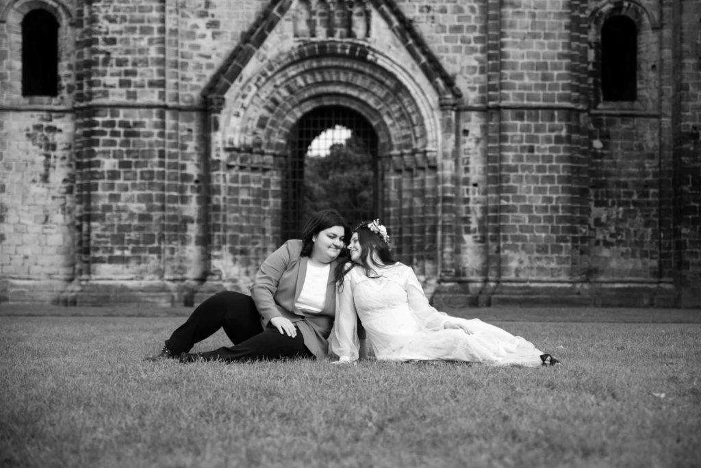 Laid-back, rustic abbey elopement with flower crown and blue suit | Joanne Lawrence  Photography | Featured on Equally Wed, the leading LGBTQ+ wedding magazine