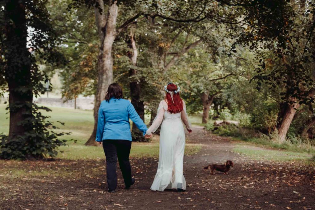 Laid-back, rustic abbey elopement with flower crown and blue suit | Joanne Lawrence  Photography | Featured on Equally Wed, the leading LGBTQ+ wedding magazine