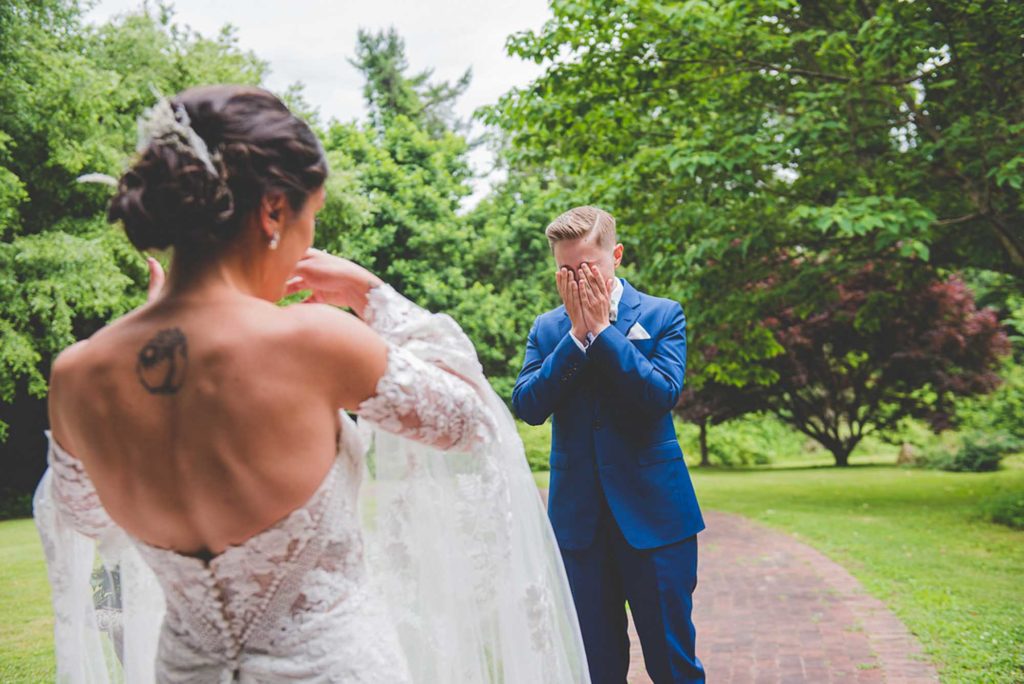 Philadelphia garden wedding with bold blue suit and cape sleeve gown | Beau Monde Originals | Featured on Equally Wed, the leading LGBTQ+ wedding magazine