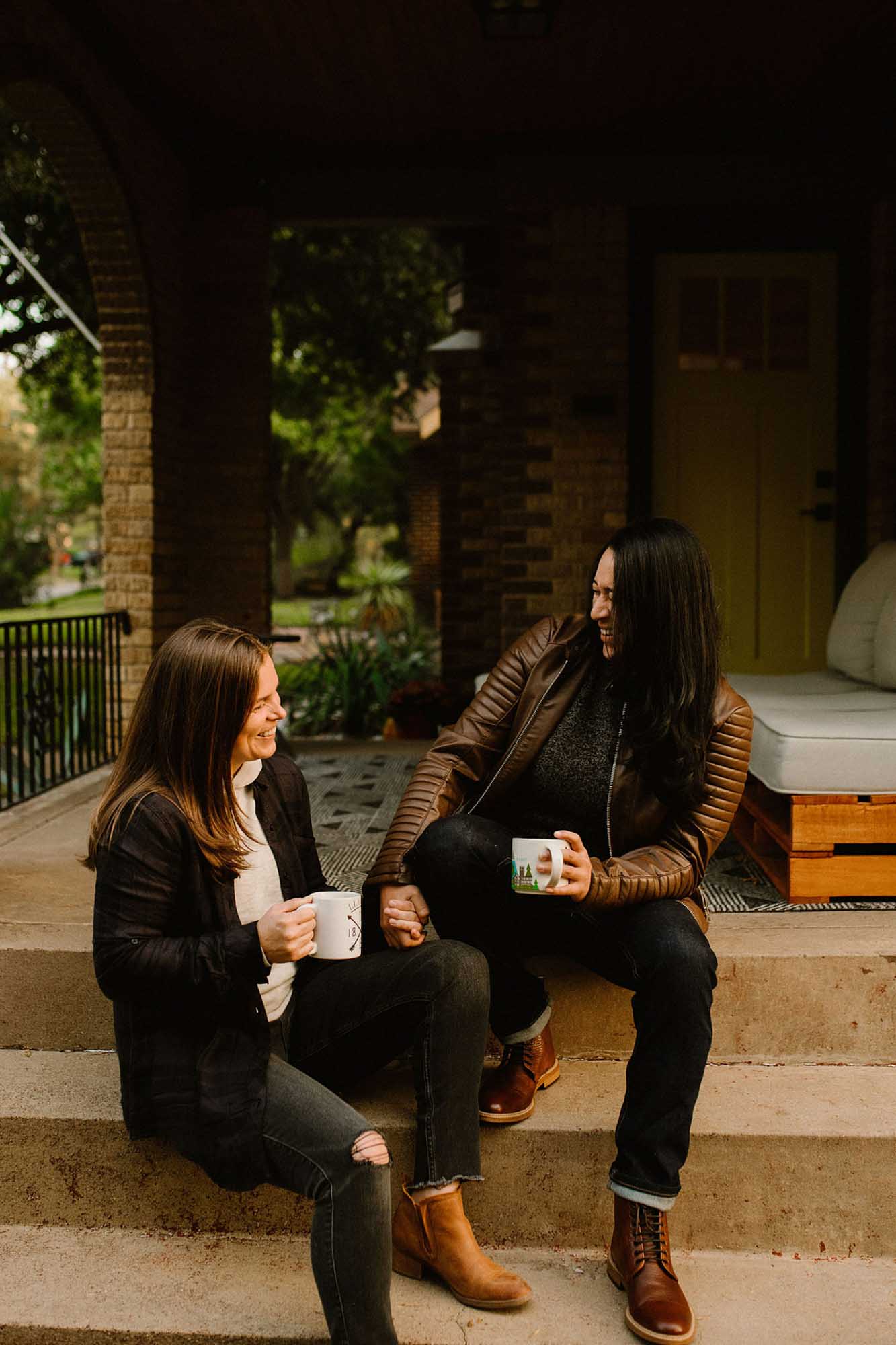 Cozy at home proposal with coffee and kisses | Whitney Rogers Photography | Featured on Equally Wed, the leading LGBTQ+ wedding magazine - coffee, house, leather jackets
