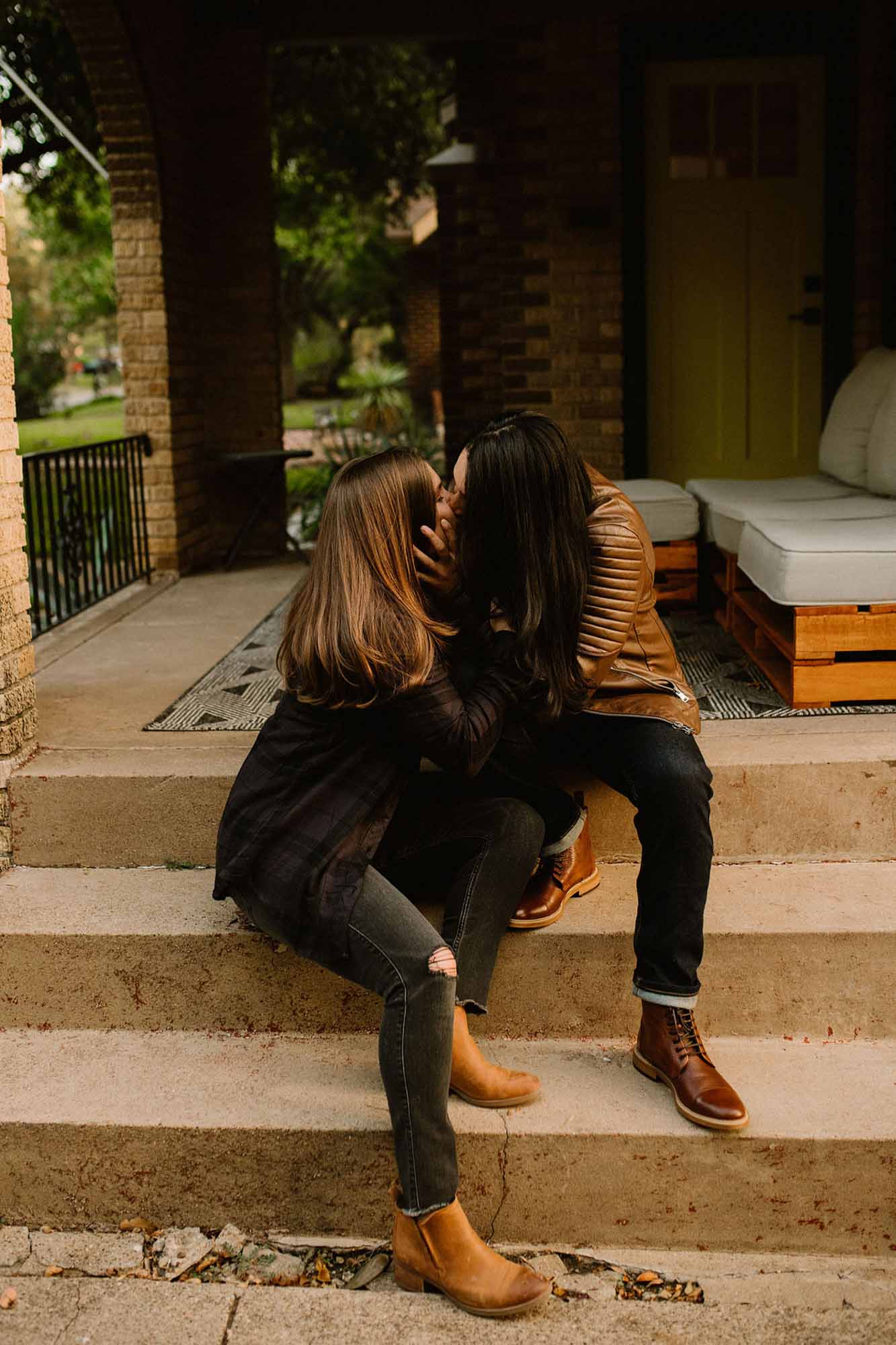 Cozy at home proposal with coffee and kisses | Whitney Rogers Photography | Featured on Equally Wed, the leading LGBTQ+ wedding magazine - kiss, leather jackets