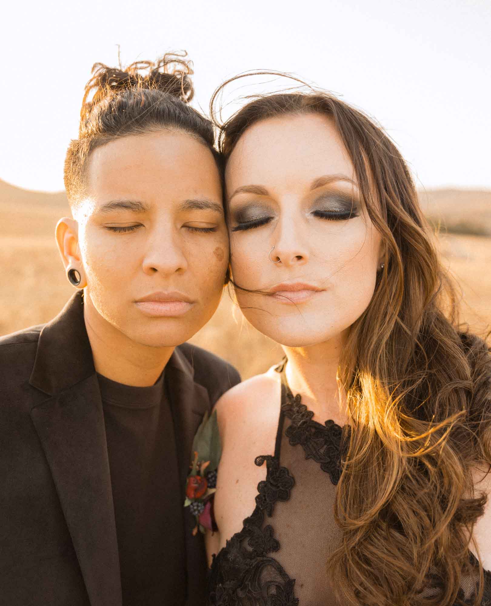 Oklahoma elopement in the Wichita Mountains with enchanting all black attire | Brooke Lewis Photography | Featured on Equally Wed, the leading LGBTQ+ wedding magazine - - forest, mountains, black attire, pride flag