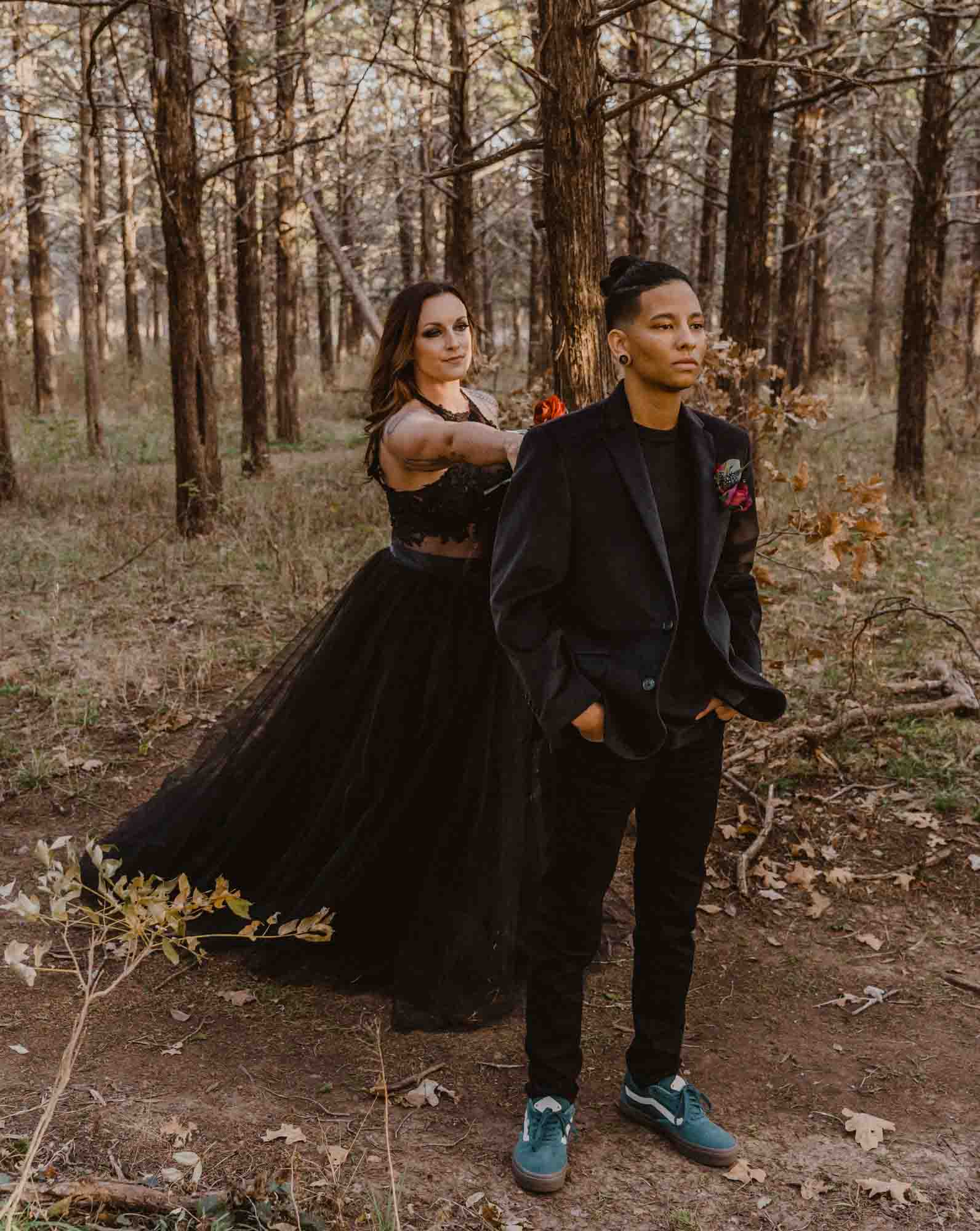 Oklahoma elopement in the Wichita Mountains with enchanting all black attire | Brooke Lewis Photography | Featured on Equally Wed, the leading LGBTQ+ wedding magazine - forest, mountains, black attire, pride flag