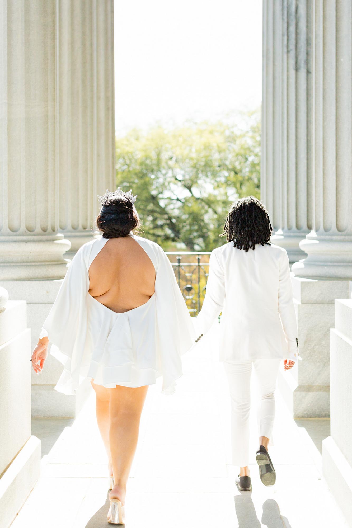 Sunny South Carolina elopement surrounded by greenery | Jessica Hunt Photography | Featured on Equally Wed, the leading LGBTQ+ wedding magazine white tux, cut out dress, tiara, crown, gold rimmed glasses