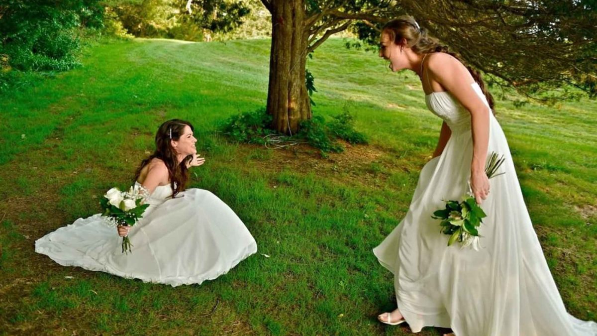 Lesbian brides accidentally wore the same dress and the first look photos are priceless