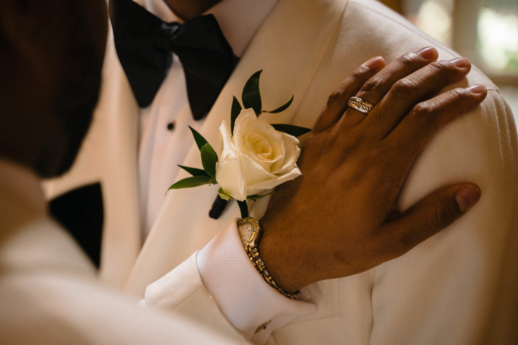 This couple transformed their home into a fabulous wedding venue | Myron Fields Photography | Featured on Equally Wed, the leading LGBTQ+ wedding magazine - ring, white tuxedo