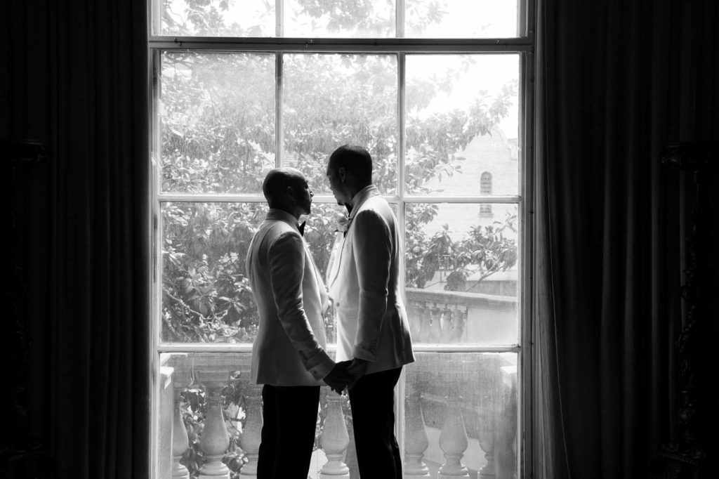 This couple transformed their home into a fabulous wedding venue | Myron Fields Photography | Featured on Equally Wed, the leading LGBTQ+ wedding magazine - grooms, black and white, tuxedos