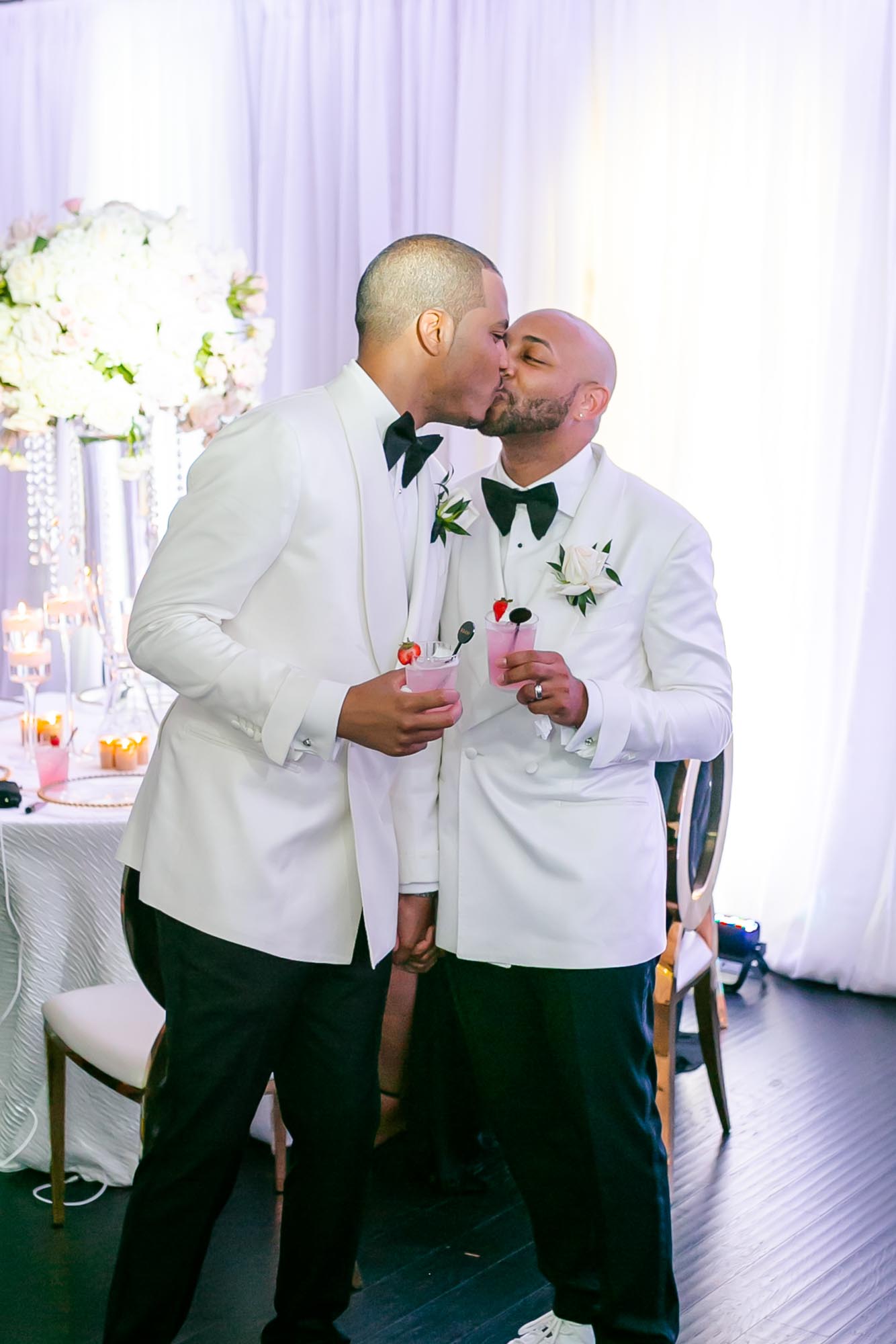 This couple transformed their home into a fabulous wedding venue | Sarandipity Photography | Featured on Equally Wed, the leading LGBTQ+ wedding magazine grooms, white tuxedo, kiss