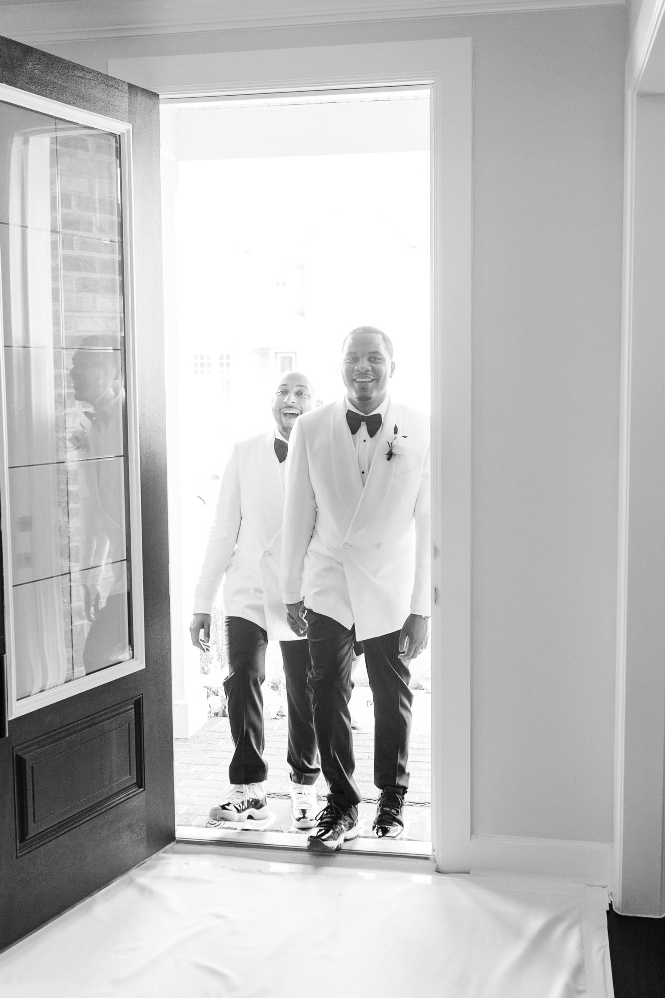 This couple transformed their home into a fabulous wedding venue | Sarandipity Photography | Featured on Equally Wed, the leading LGBTQ+ wedding magazine - grooms, white tuxedo