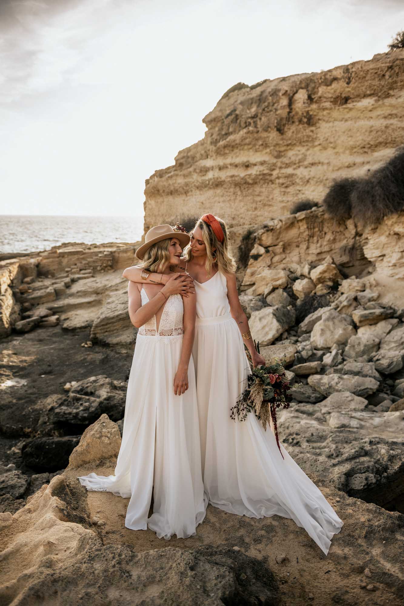 Epic surprise proposal during a styled shoot on the shores of Mallorca | Ilona Antina Photography | Featured on Equally Wed, the leading LGBTQ+ wedding magazine - black outfits