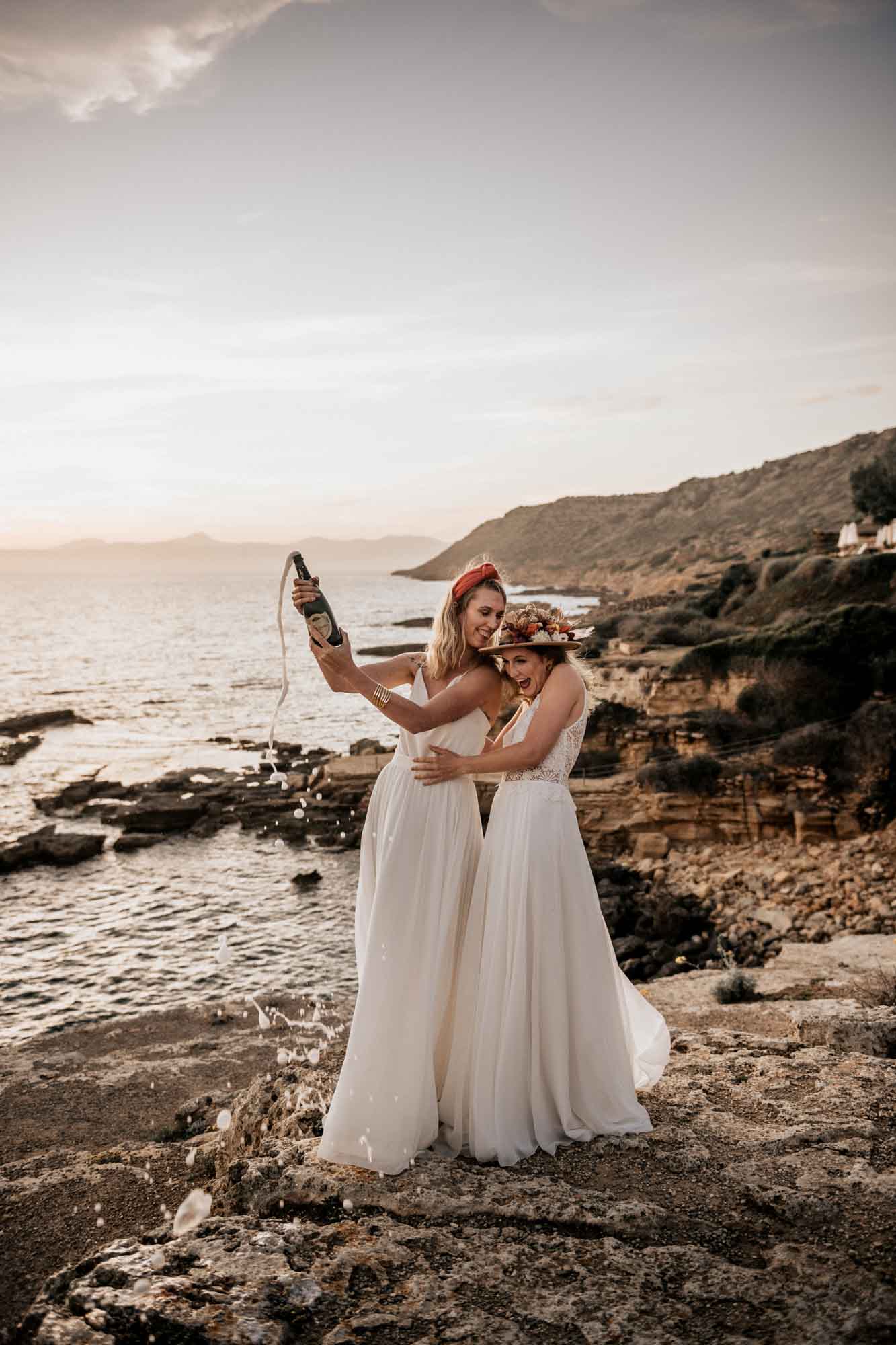 Epic surprise proposal during a styled shoot on the shores of Mallorca | Ilona Antina Photography | Featured on Equally Wed, the leading LGBTQ+ wedding magazine - black outfits