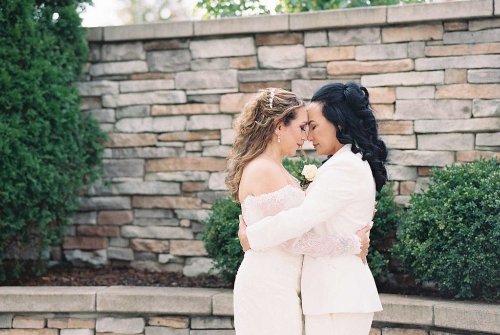 Joyful intimate wedding outside Chicago with geometric arch and outfit change | Stephanie Michelle Photography | Featured on Equally Wed, the leading LGBTQ+ wedding magazine