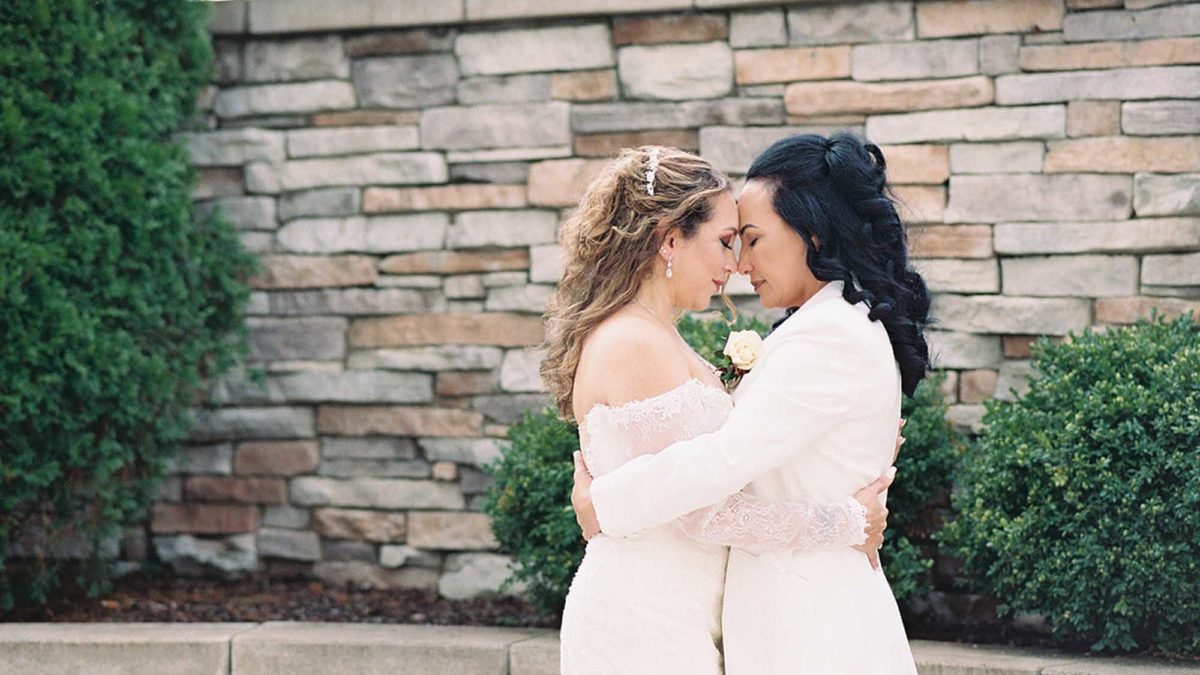 Joyful intimate wedding outside Chicago with geometric arch and outfit change