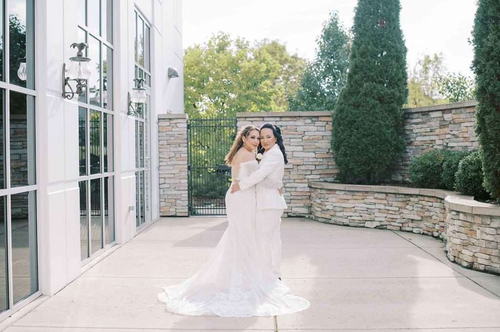 Joyful intimate wedding outside Chicago with geometric arch and outfit change | Stephanie Michelle Photography | Featured on Equally Wed, the leading LGBTQ+ wedding magazine