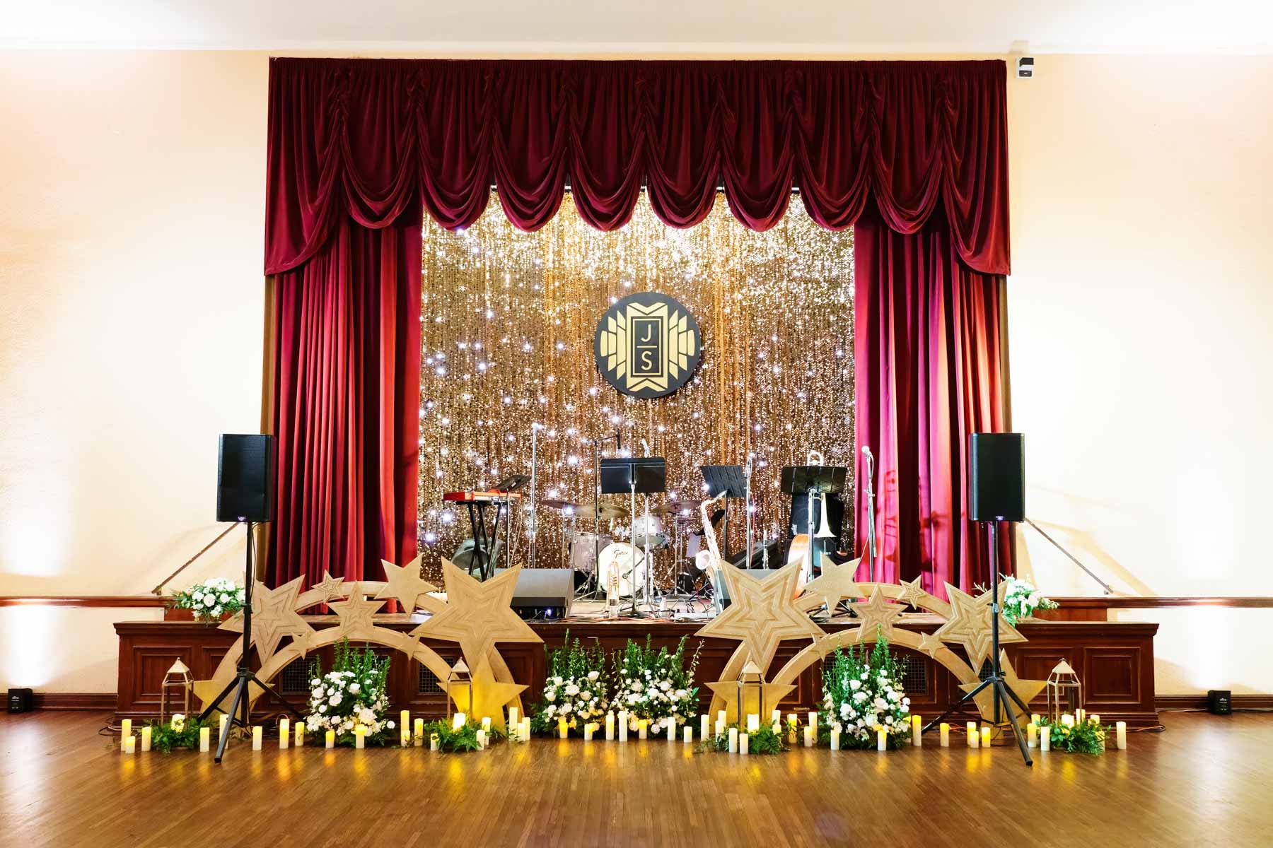 custom gold backdrop on wedding stage