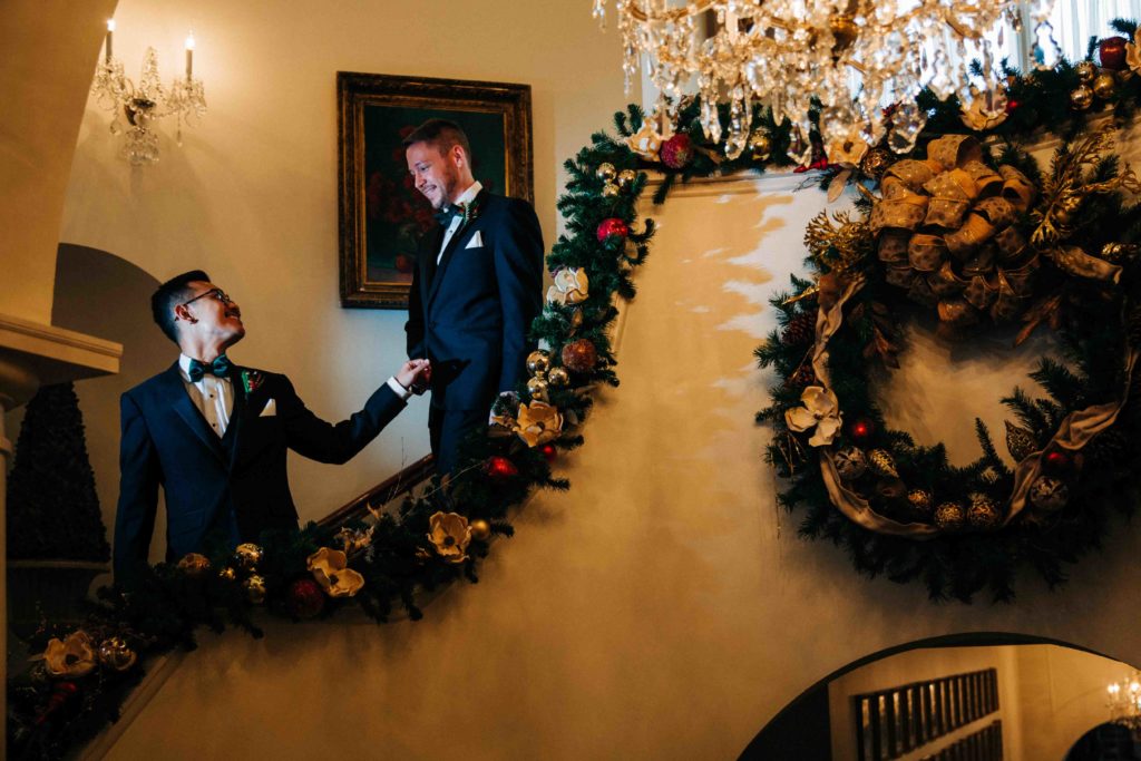 two grooms at gay wedding with Christmas decor
