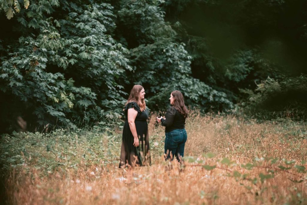 Romantic proposal with wine and nature at Seattle's Discovery Park | Rove Coast Photography | Featured on Equally Wed, the leading LGBTQ+ wedding magazine