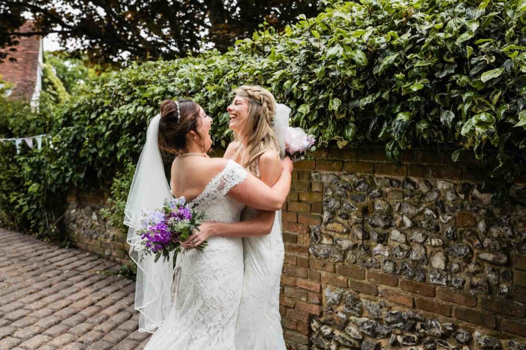 brides, lesbian wedding, wildflowers, purple flowers