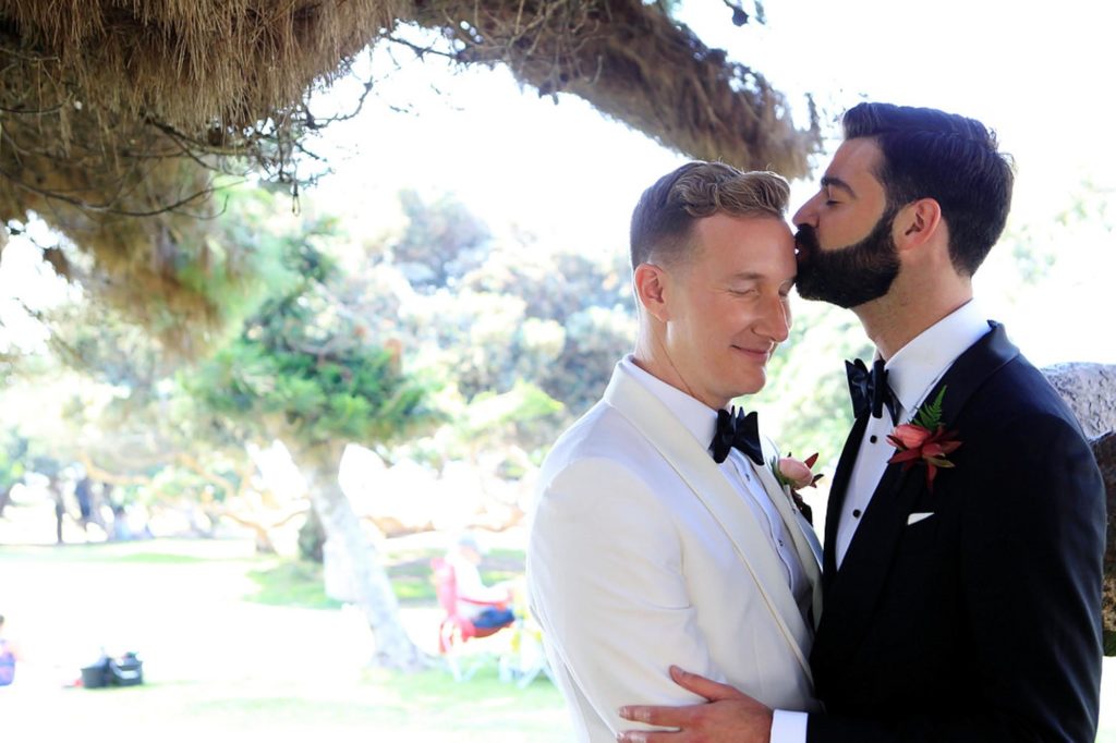 Wedding day, kiss, custom white tux, custom black tux