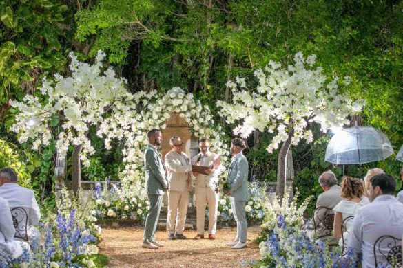 gay wedding outdoors with white flowers