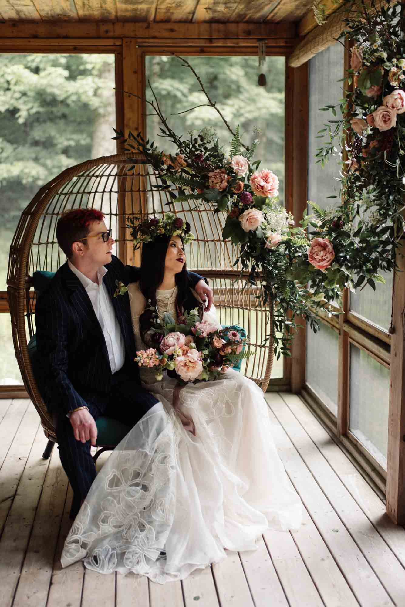 cottagecore, egg chair, greenery, pink florals, happy couple