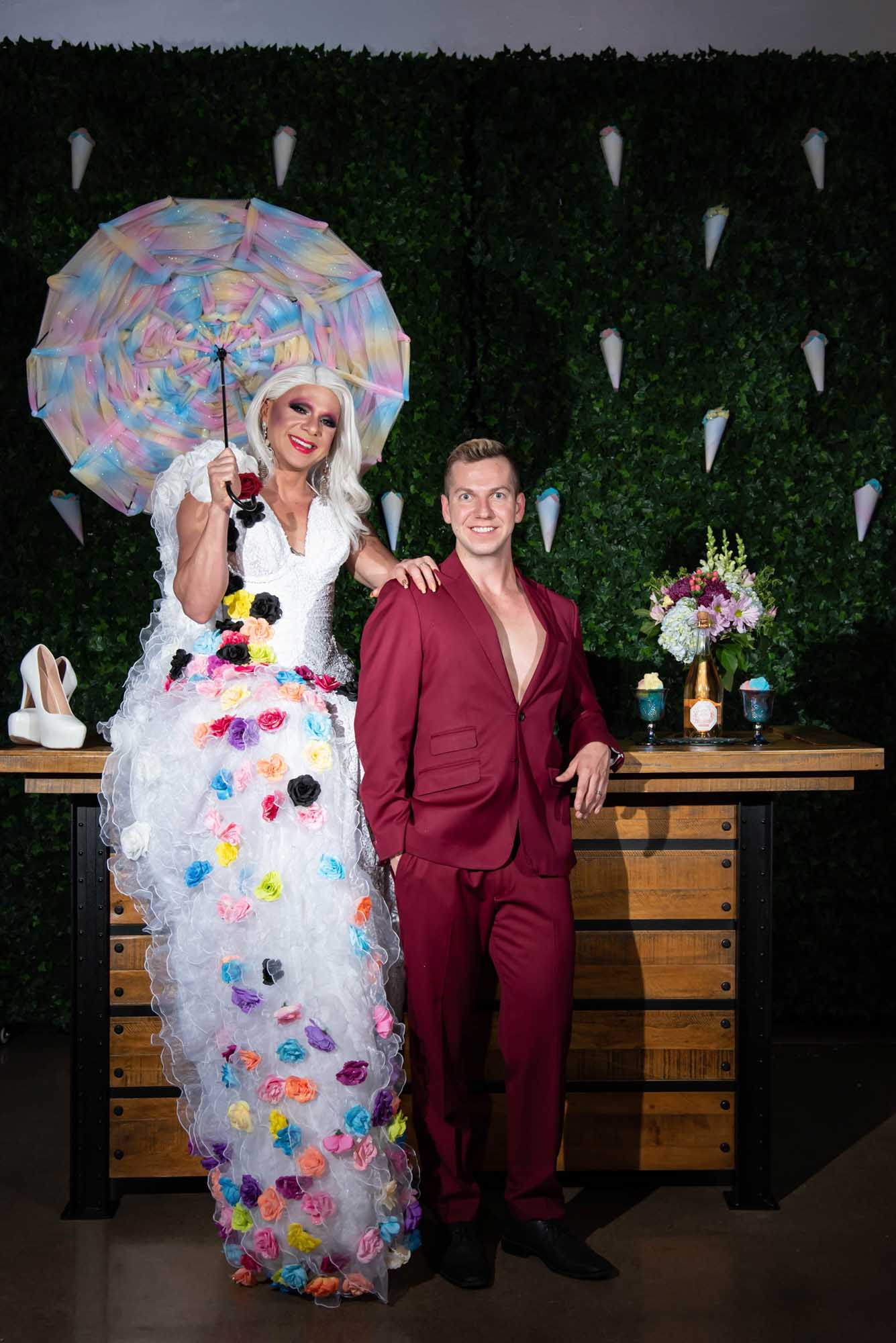 floral gown, red suit, cotton candy wall, umbrella, drag queen wedding