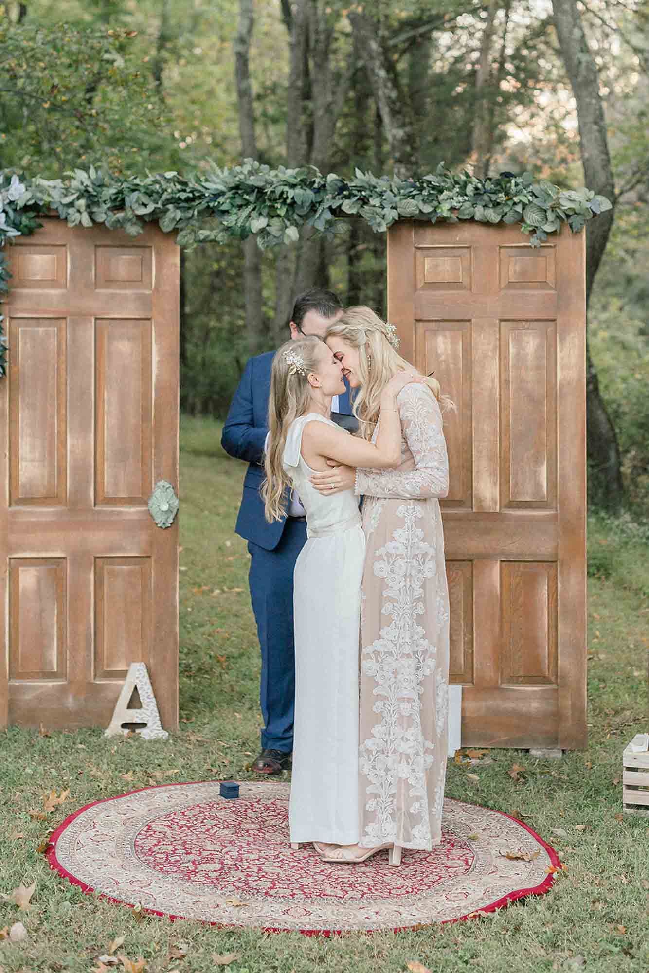 wedding ceremony, kiss, outdoor, greenery, two doors