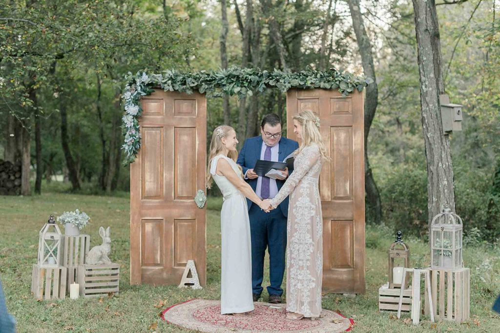 wedding ceremony, greenery, two doors