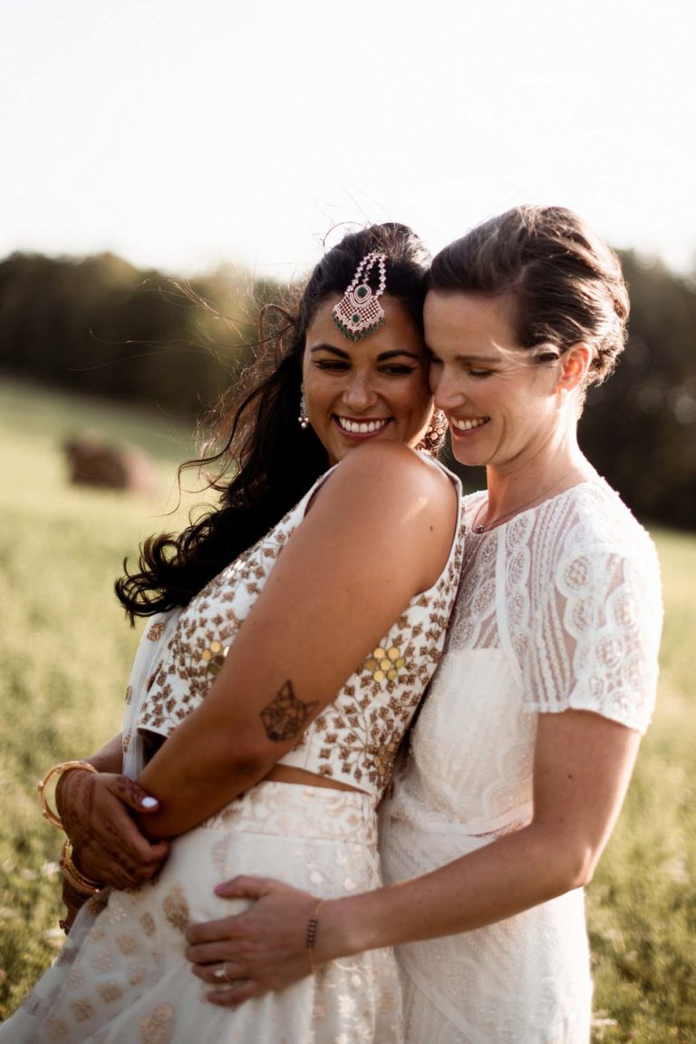 Sunny outdoor Canadian wedding with haystack photos and geometric arch