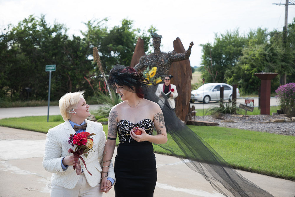 Good Omens–inspired styled elopement with angelic forms, red poppies, goblets and crosses