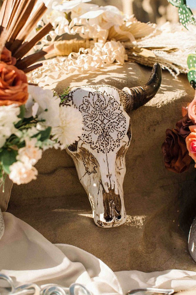 Desert wedding styling with cow skull