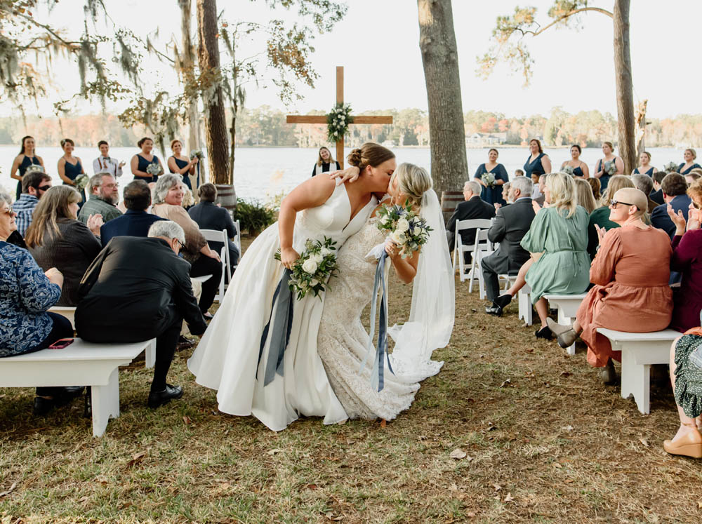 two brides kiss at their wedding
