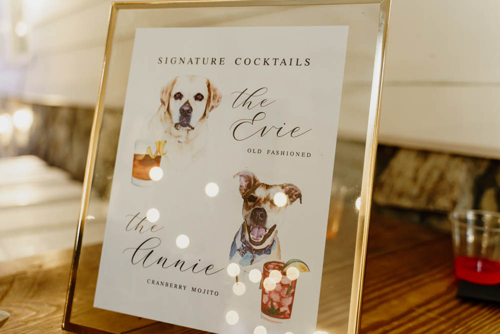 watercolor paintings of two dogs as a sign for signature wedding cocktails