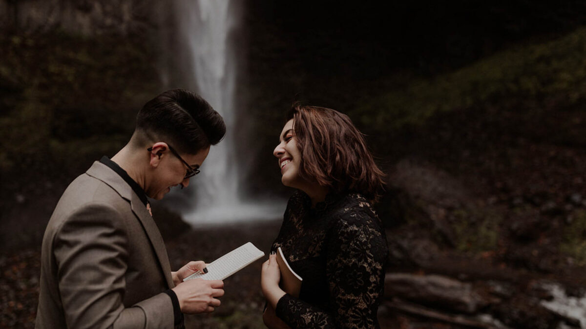 Dark-and-moody photoshoot turns into romantic proposal at the base of a waterfall