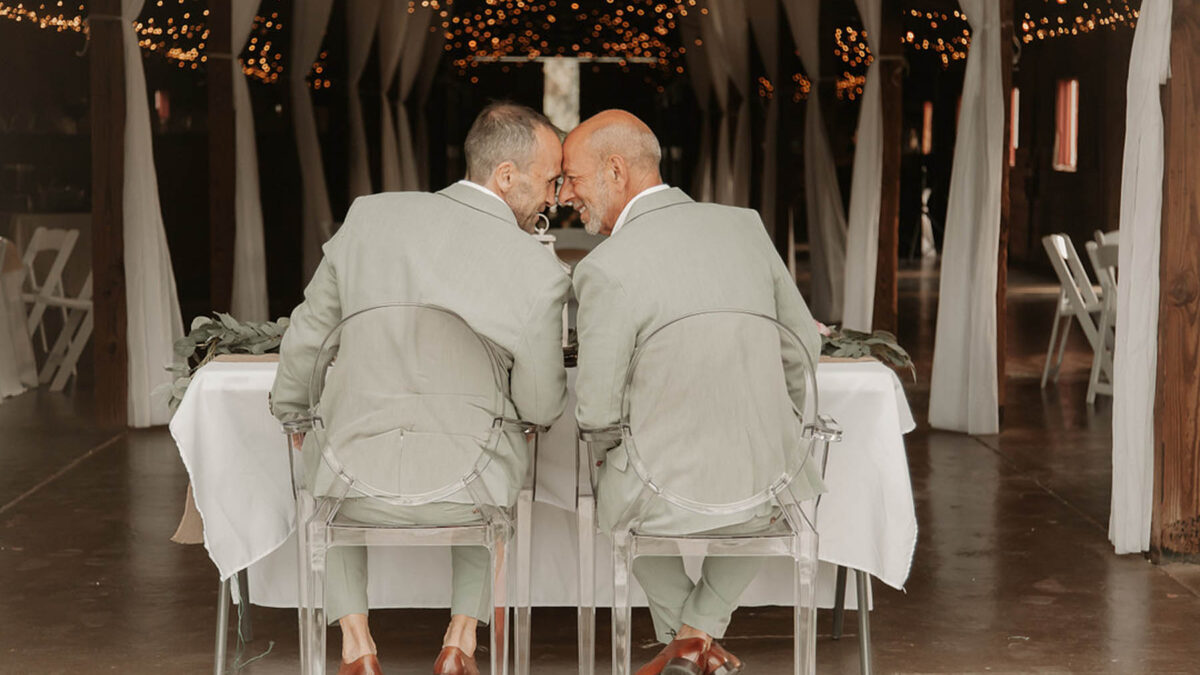 These grooms walked down the aisle together with their dog in their outdoor Savannah, Georgia, LGBTQ+ wedding