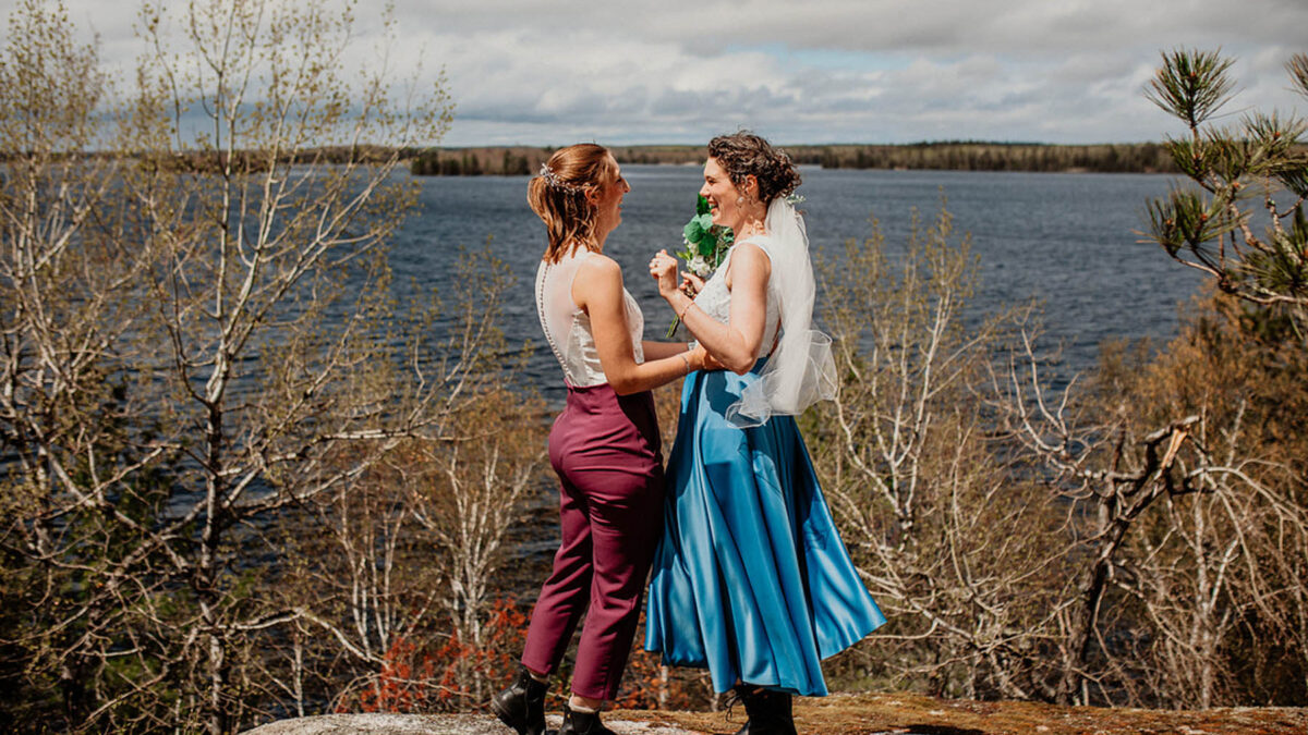 This springtime lakeside elopement featured upcycled wedding outfits and a mountaintop picnic