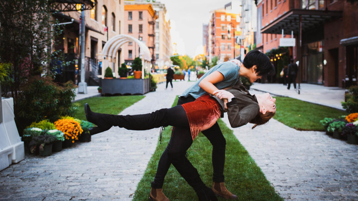 A playful fall engagement photo shoot for a creative, adventure-loving lesbian couple