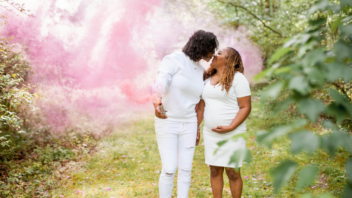 An outdoor gender reveal photoshoot in Virginia, celebrating a new addition to an LGBTQ+ family