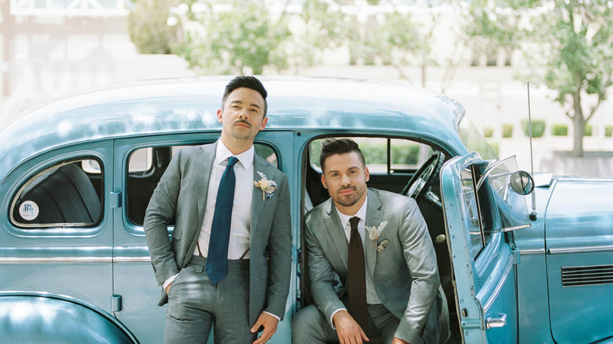 Get inspired for your gay wedding with this chic styled shoot featuring real-life husbands, a vintage car and whimsical florals